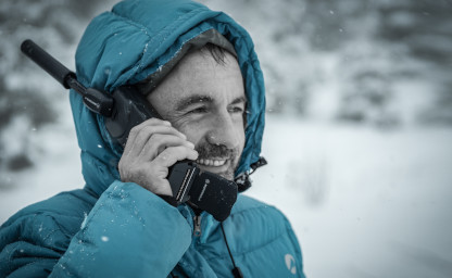 image of man using satellite phone