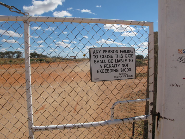 Sign on gate at Cameron Corner on the NSW/SA/Qld state border